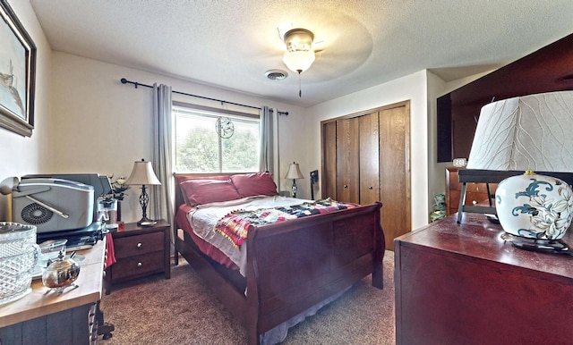 1804 Oliver Dr Unit 8, Urbana, IL 61802 - carpeted bedroom featuring a closet, a textured ceiling, and ceiling fan
