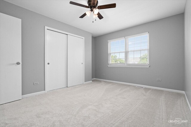 1889 Shore Line Ct, Romeoville, IL 60446 - unfurnished bedroom with a closet, carpet floors, and ceiling fan