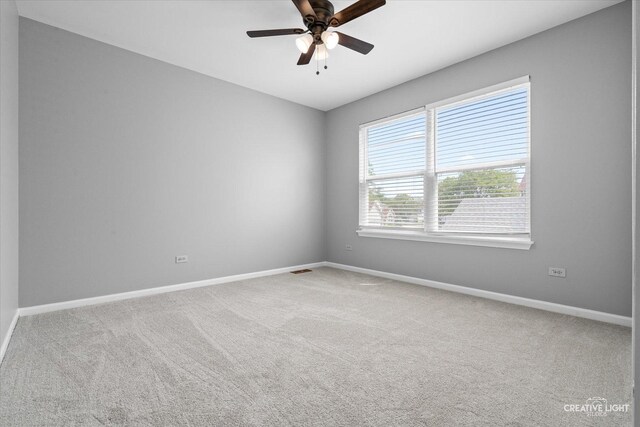 1889 Shore Line Ct, Romeoville, IL 60446 - carpeted empty room featuring baseboards and ceiling fan