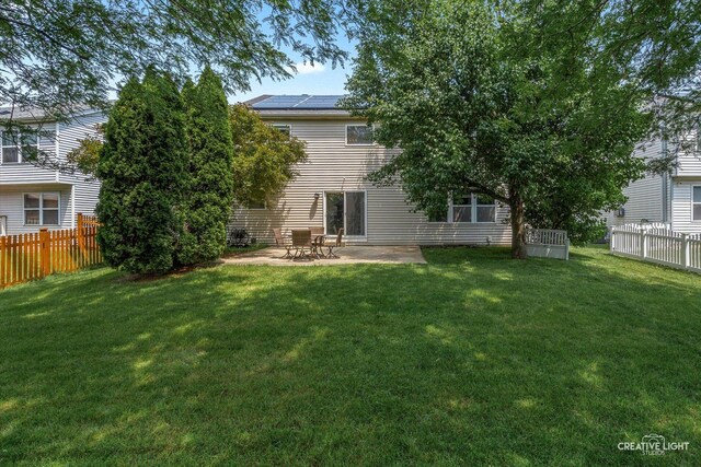 1889 Shore Line Ct, Romeoville, IL 60446 - back of house with a patio and roof mounted solar panels