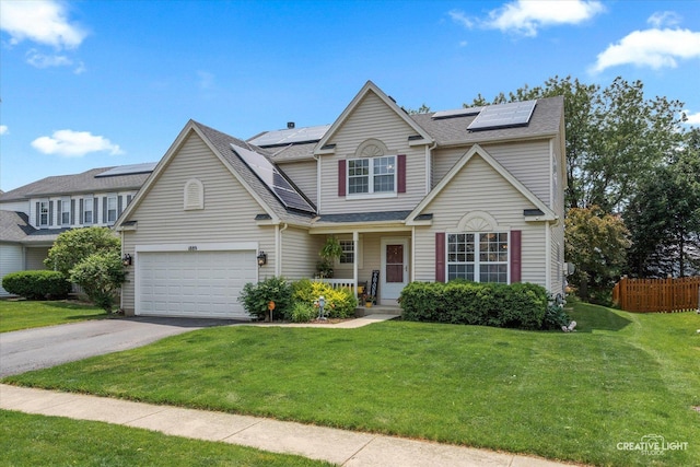 1889 Shore Line Ct, Romeoville, IL 60446 - traditional-style home with driveway, roof mounted solar panels, a porch, an attached garage, and roof with shingles