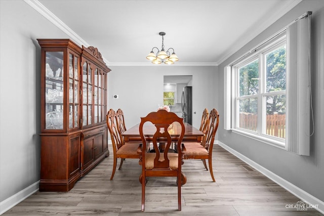 1889 Shore Line Ct, Romeoville, IL 60446 - dining room featuring a chandelier, crown molding, and light wood finished floors