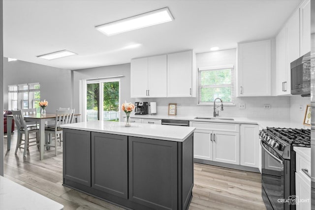 1889 Shore Line Ct, Romeoville, IL 60446 - kitchen featuring appliances with stainless steel finishes, light wood-type flooring, a kitchen island, healthy amount of natural light, and recessed lighting