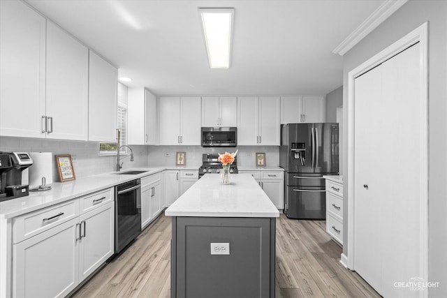 1889 Shore Line Ct, Romeoville, IL 60446 - kitchen with stainless steel appliances, a center island, white cabinets, tasteful backsplash, and light wood-type flooring