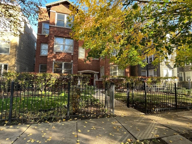4413 N Malden St Unit 2S, Chicago, IL 60640 - view of front of home with brick siding and a fenced front yard