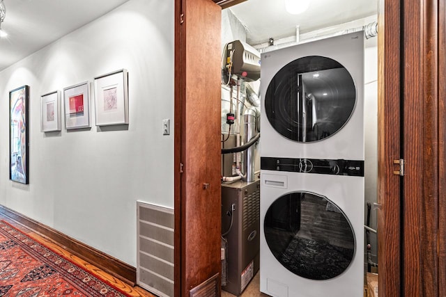 4413 N Malden St Unit 2S, Chicago, IL 60640 - laundry area featuring stacked washer / dryer and wood finished floors