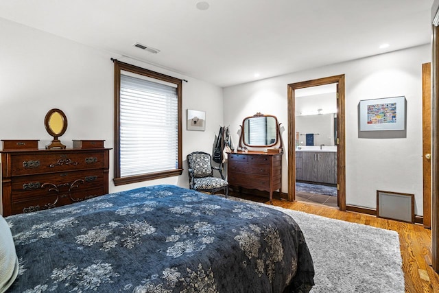 4413 N Malden St Unit 2S, Chicago, IL 60640 - bedroom with wood finished floors, ensuite bath, and recessed lighting