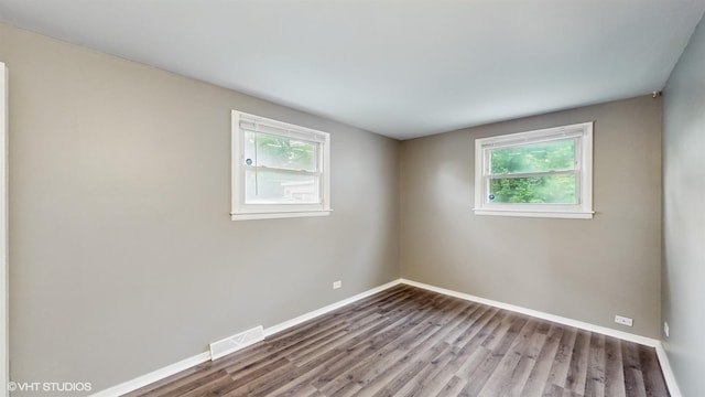 1917 W 163rd St, Markham, IL 60428 - spare room featuring healthy amount of natural light and wood finished floors