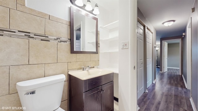 1917 W 163rd St, Markham, IL 60428 - half bath with vanity, wood finished floors, tile walls, and tasteful backsplash