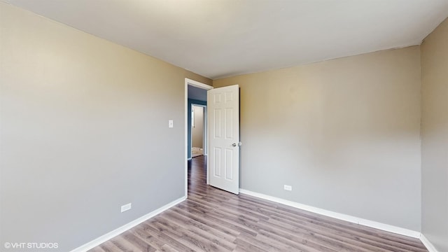 1917 W 163rd St, Markham, IL 60428 - spare room featuring baseboards and light wood finished floors