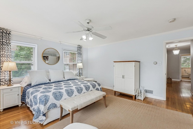 504 S Spring Ave, La Grange, IL 60525 - bedroom with ornamental molding, wood finished floors, and a ceiling fan