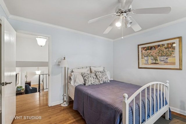 504 S Spring Ave, La Grange, IL 60525 - bedroom with wood finished floors, ornamental molding, and a ceiling fan