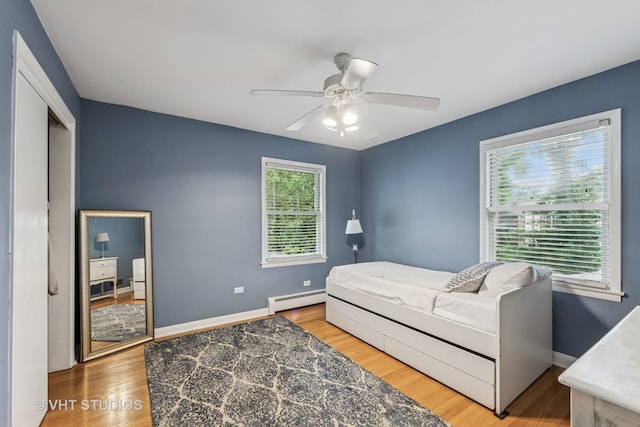 504 S Spring Ave, La Grange, IL 60525 - bedroom with a baseboard heating unit, wood finished floors, and a ceiling fan
