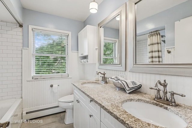 504 S Spring Ave, La Grange, IL 60525 - full bath featuring a baseboard radiator, healthy amount of natural light, double vanity, wainscoting, and shower / bath combination with curtain