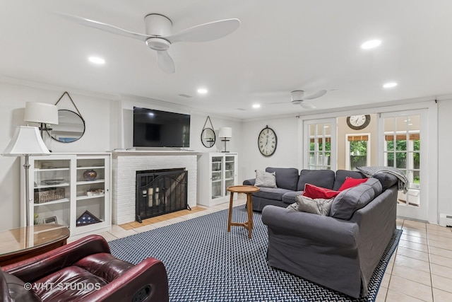 504 S Spring Ave, La Grange, IL 60525 - tiled living room featuring a ceiling fan, a brick fireplace, ornamental molding, and recessed lighting