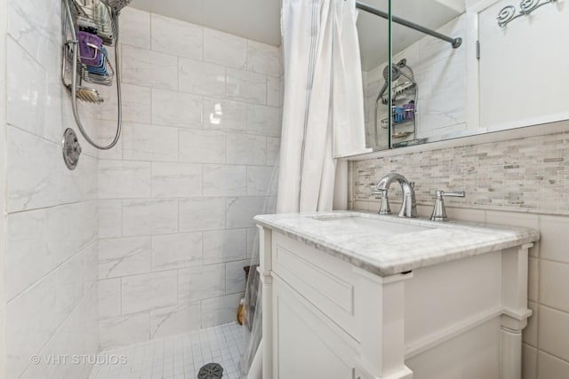 504 S Spring Ave, La Grange, IL 60525 - full bath featuring tiled shower, vanity, tile walls, and backsplash