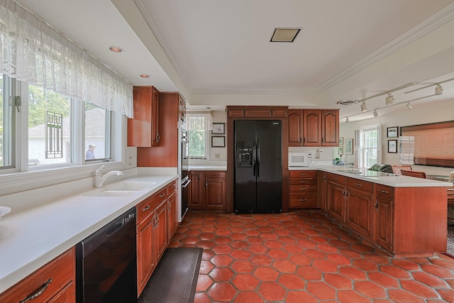 1596 W Palatine Rd, Inverness, IL 60067 - kitchen featuring black appliances, a peninsula, light countertops, crown molding, and brown cabinets