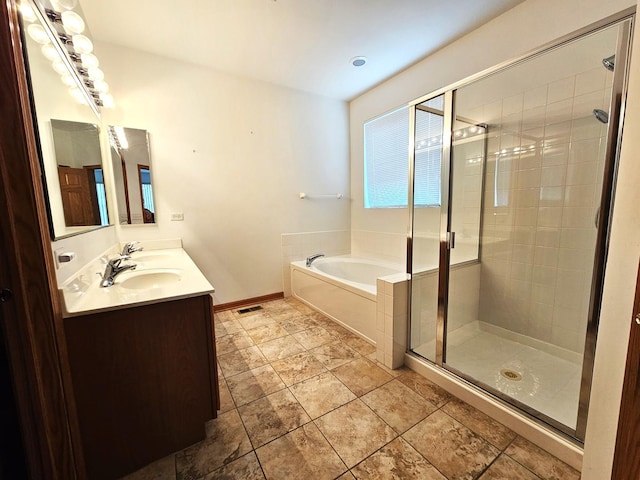 2 Kenilworth Ct, Cary, IL 60013 - full bath featuring a bath, a stall shower, and double vanity