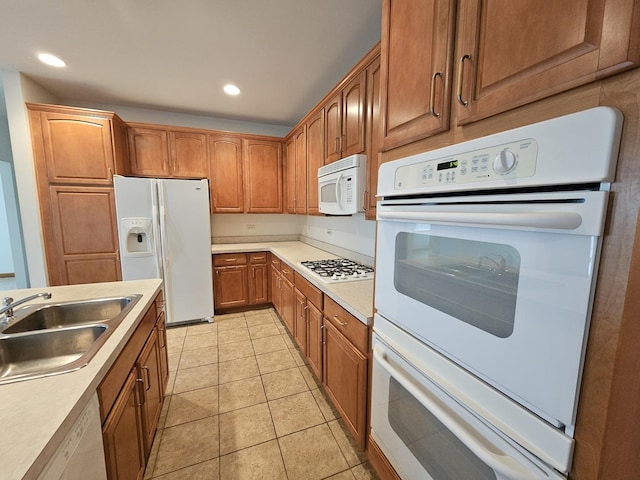 2 Kenilworth Ct, Cary, IL 60013 - kitchen featuring white appliances, light countertops, brown cabinetry, recessed lighting, and light tile patterned floors
