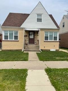 7324 W 56th Pl, Summit, IL 60501 - bungalow-style house featuring brick siding and a front yard