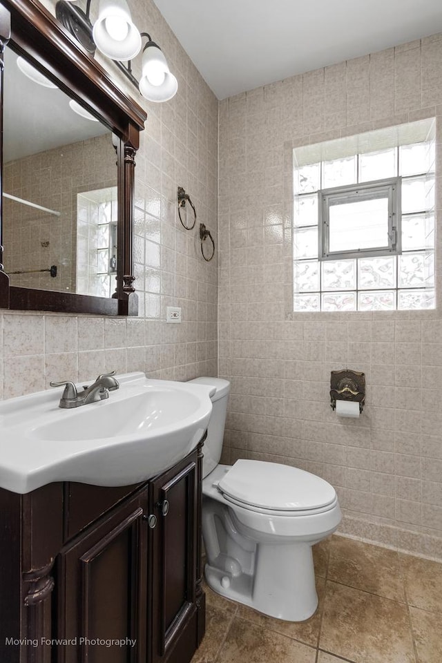 7324 W 56th Pl, Summit, IL 60501 - full bathroom featuring tile walls, healthy amount of natural light, vanity, and a shower