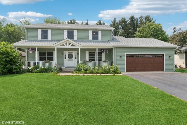 612 Pine View Pass, Lake Villa, IL 60046 - view of front of property with asphalt driveway, covered porch, a garage, and a front lawn
