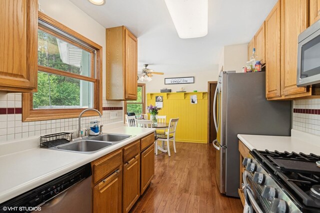 612 Pine View Pass, Lake Villa, IL 60046 - kitchen with appliances with stainless steel finishes, light countertops, wood finished floors, and tasteful backsplash