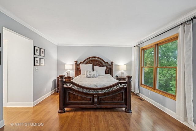 436 Kelly Ln, Crystal Lake, IL 60012 - bedroom with light wood finished floors and crown molding