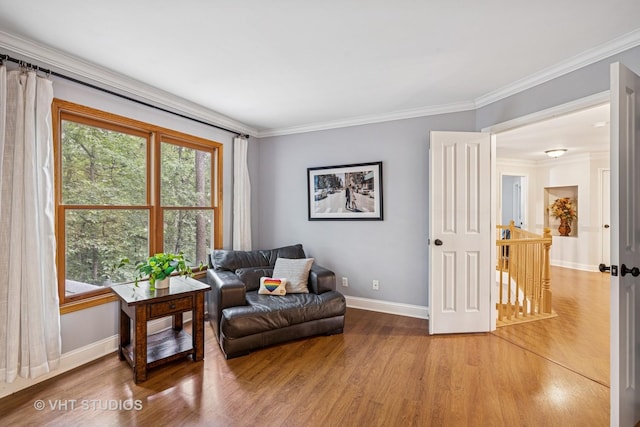 436 Kelly Ln, Crystal Lake, IL 60012 - living area featuring wood finished floors, healthy amount of natural light, an upstairs landing, and crown molding