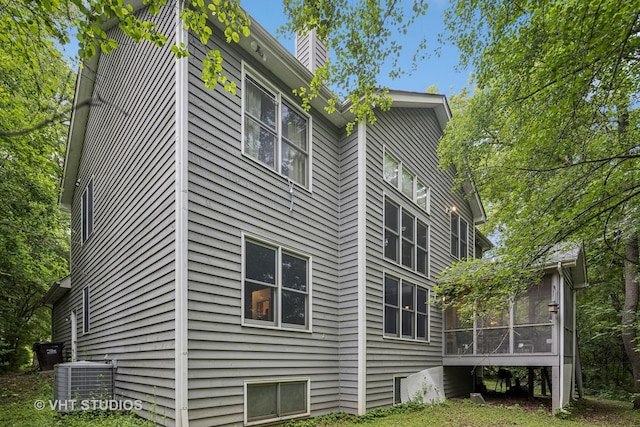 436 Kelly Ln, Crystal Lake, IL 60012 - view of property exterior featuring a sunroom and a chimney