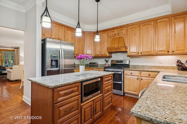 436 Kelly Ln, Crystal Lake, IL 60012 - kitchen featuring appliances with stainless steel finishes, custom range hood, dark wood finished floors, light stone countertops, and a center island