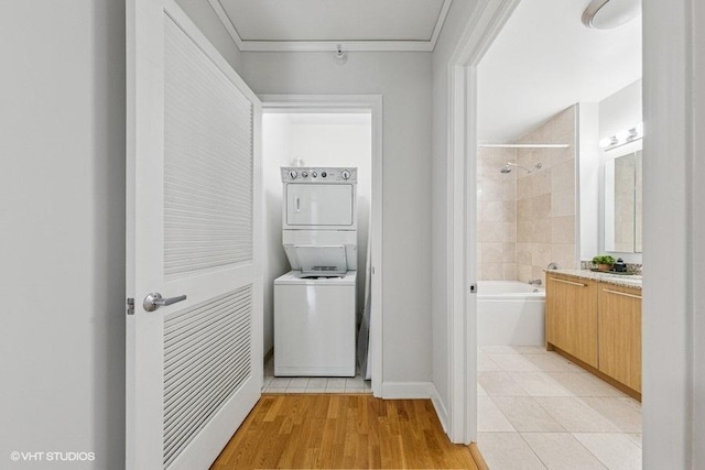 450 E Waterside Dr Unit 906, Chicago, IL 60601 - washroom featuring stacked washer and clothes dryer and light tile patterned flooring