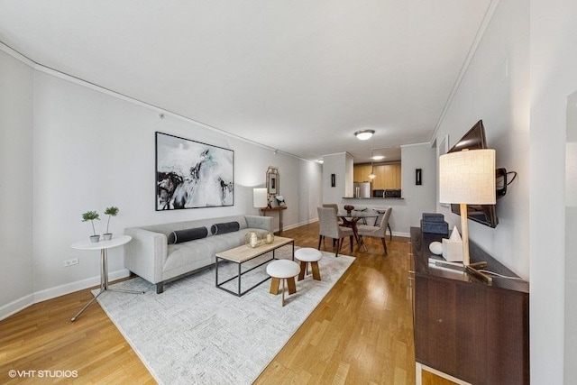 450 E Waterside Dr Unit 906, Chicago, IL 60601 - living room with light wood-style floors, crown molding, and baseboards