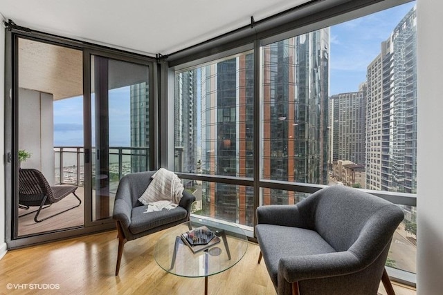 450 E Waterside Dr Unit 906, Chicago, IL 60601 - sitting room featuring wood finished floors, a wall of windows, and a view of city