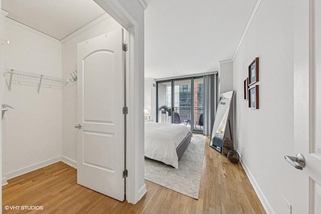 450 E Waterside Dr Unit 906, Chicago, IL 60601 - bedroom with crown molding, access to exterior, light wood-type flooring, and baseboards
