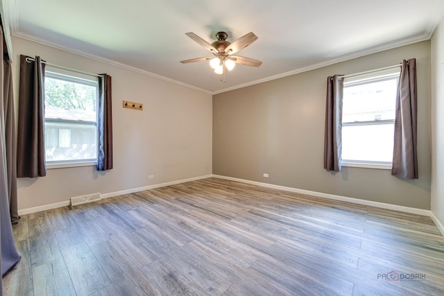 4519 W Shore Dr, Mchenry, IL 60050 - spare room with wood finished floors, ceiling fan, and crown molding