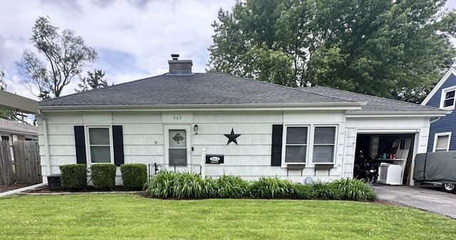 963 Oneida St, Joliet, IL 60435 - view of front facade featuring an attached garage, driveway, a chimney, and a shingled roof