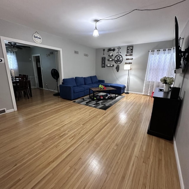 963 Oneida St, Joliet, IL 60435 - living room featuring light wood-type flooring, healthy amount of natural light, and a ceiling fan