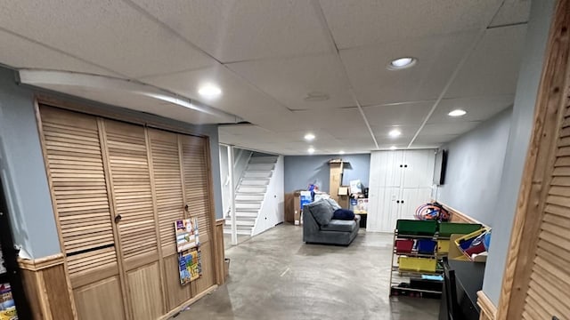 963 Oneida St, Joliet, IL 60435 - sitting room with concrete flooring, recessed lighting, stairs, and a paneled ceiling