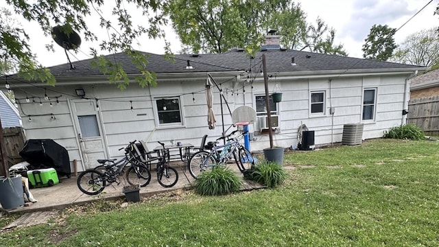 963 Oneida St, Joliet, IL 60435 - rear view of house featuring a patio area and a chimney