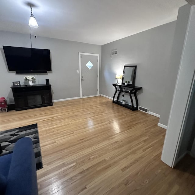 963 Oneida St, Joliet, IL 60435 - unfurnished living room with wood finished floors