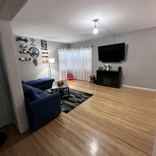963 Oneida St, Joliet, IL 60435 - living area featuring wood finished floors and a fireplace