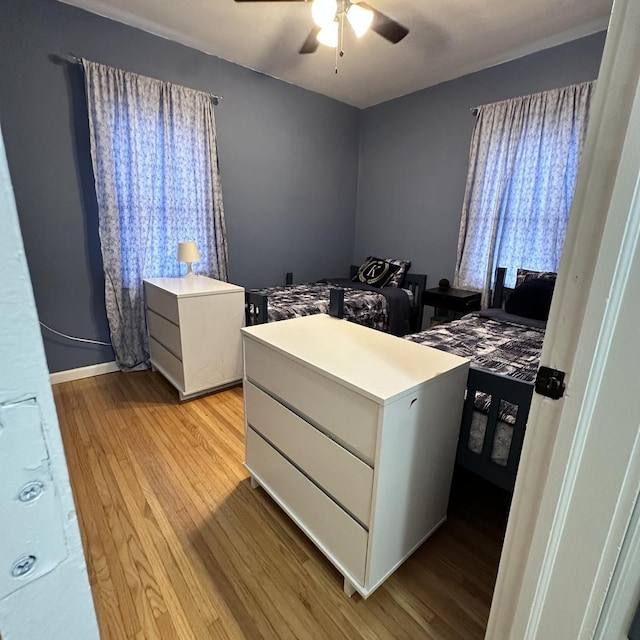 963 Oneida St, Joliet, IL 60435 - bedroom with light wood finished floors and a ceiling fan