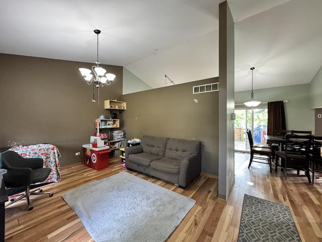 1419 Major Dr, Plainfield, IL 60586 - living room featuring lofted ceiling, wood finished floors, and a chandelier