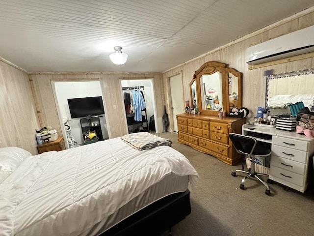 1419 Major Dr, Plainfield, IL 60586 - bedroom featuring a wall unit AC, carpet, wooden walls, a walk in closet, and a closet