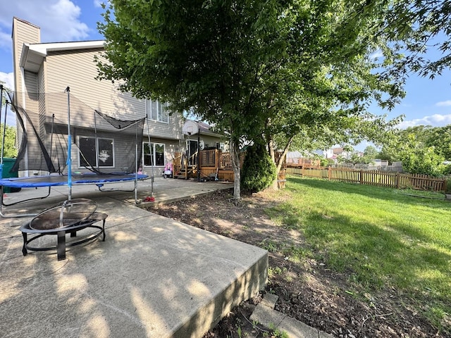 1419 Major Dr, Plainfield, IL 60586 - view of yard with a trampoline, a patio, a fire pit, and a deck