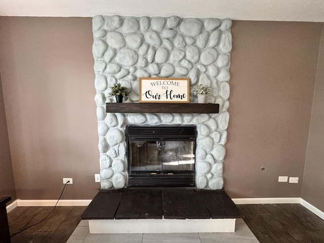 1419 Major Dr, Plainfield, IL 60586 - detailed view of wood finished floors, baseboards, and a fireplace