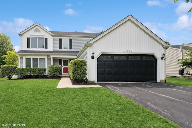 1370 Glacier Pkwy, Algonquin, IL 60102 - view of front of house with an attached garage, asphalt driveway, and a front lawn
