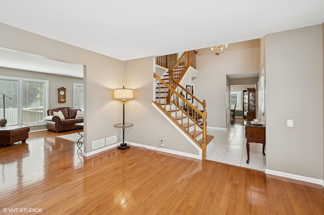 1370 Glacier Pkwy, Algonquin, IL 60102 - staircase featuring wood finished floors, a chandelier, and baseboards