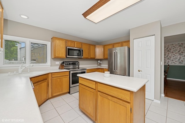 1370 Glacier Pkwy, Algonquin, IL 60102 - kitchen featuring appliances with stainless steel finishes, light tile patterned floors, a sink, and light countertops